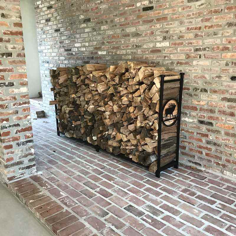 Clean firewood delivery area after professional stacking
